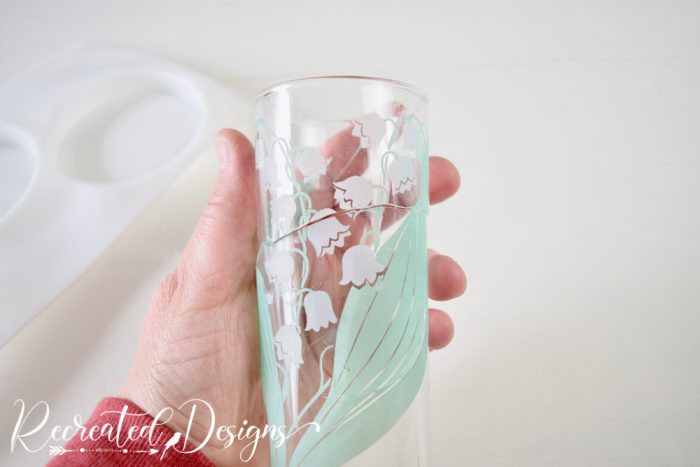 broken glass with Lily-of-the-Valley on it