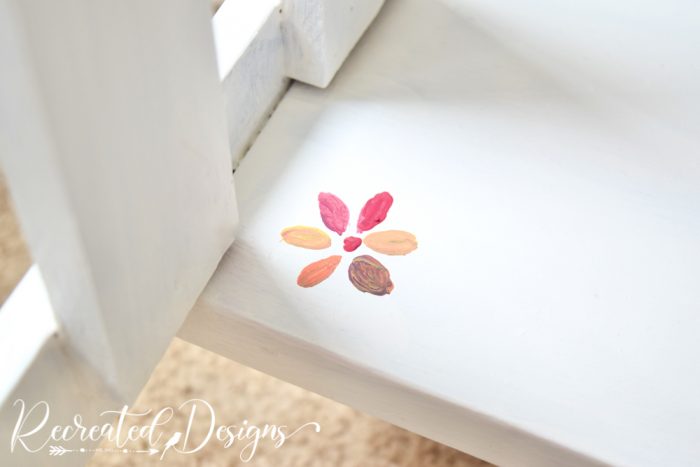 small flower painted on a table