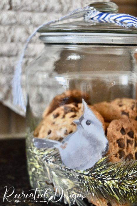 cookie in a glass jar with a bluebird