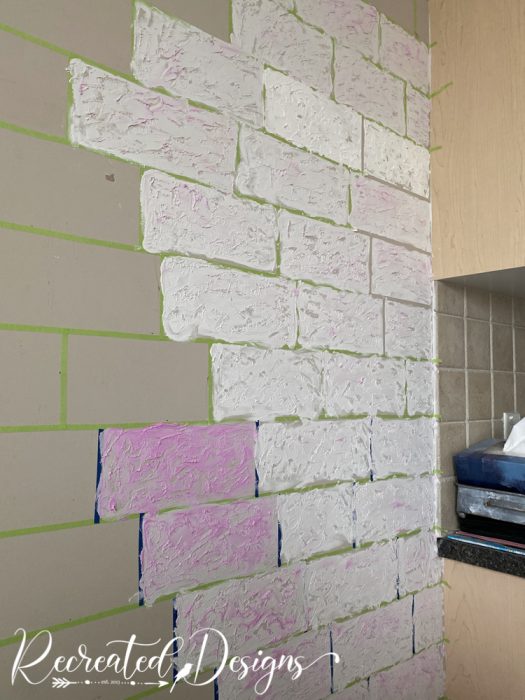 creating faux bricks with spackling on a wall