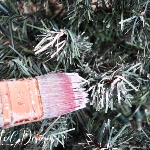 painting a Christmas tree white