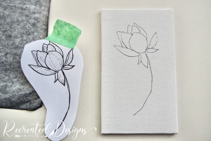 the outline of a flower on a small canvas