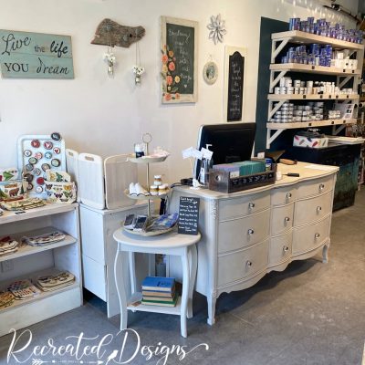 reclaimed dresser changed into a front desk at a shop