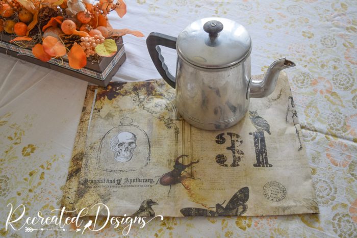 a vintage coffee pot and a piece of Halloween decoupage paper 