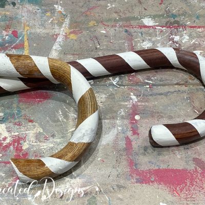 two canes painted with white stripes