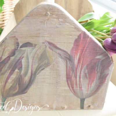 tulips on the end of a wood tool caddy